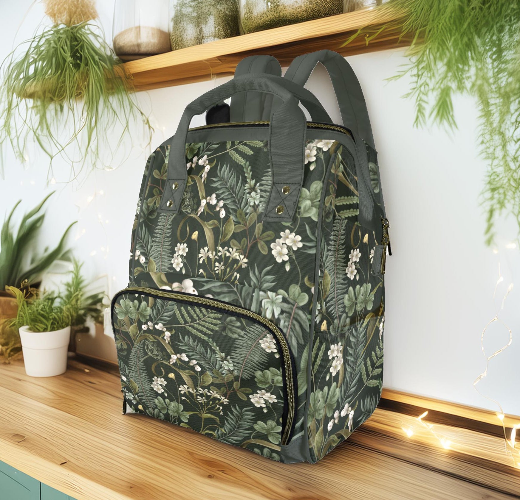 a diaper backpack with a botanical pattern
