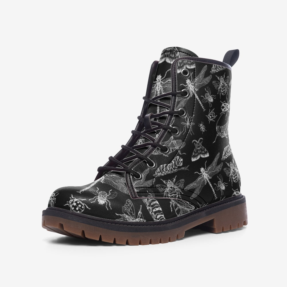 black vegan combat boots with a pattern of whimsical insects on them
