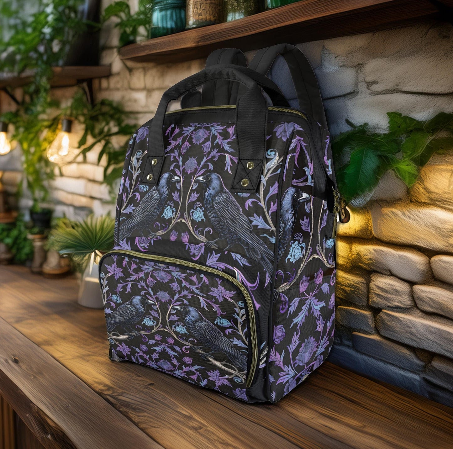 a multifunctional diaper backpack with a gothic ravens pattern on it