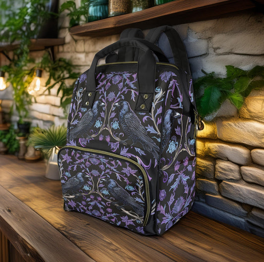 a multifunctional diaper backpack with a gothic ravens pattern on it