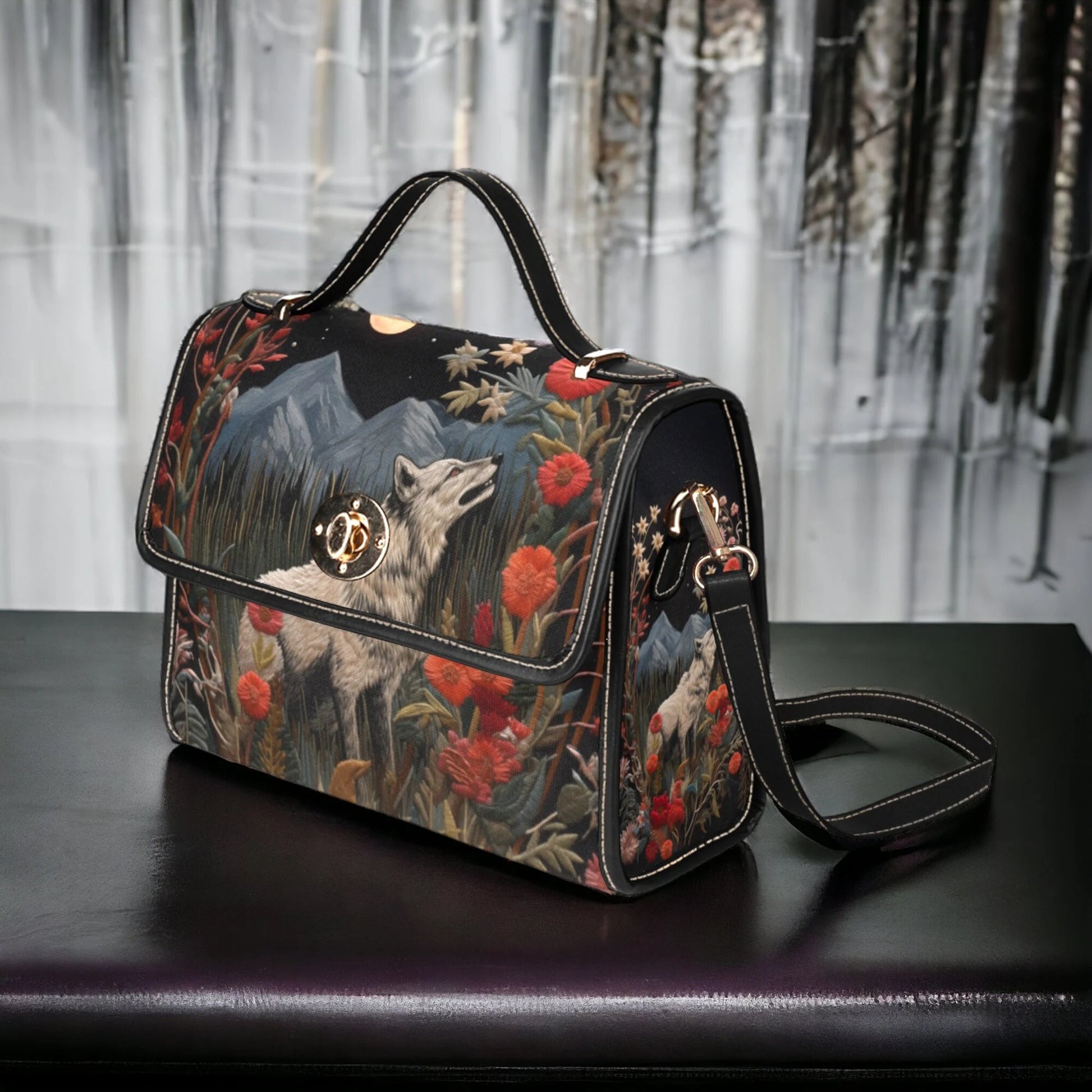 Handbag with wolf and floral design on a dark surface